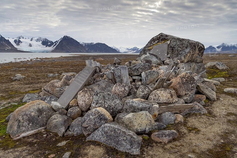 Remains of wooden coffins and gravestones