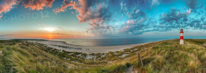 Panorama at the elbow with sunset and lighthouse