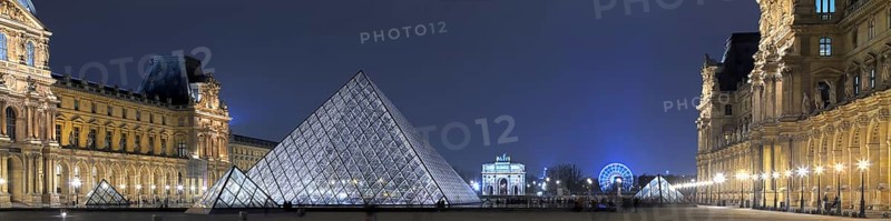 Illuminated Louvre with glass pyramid