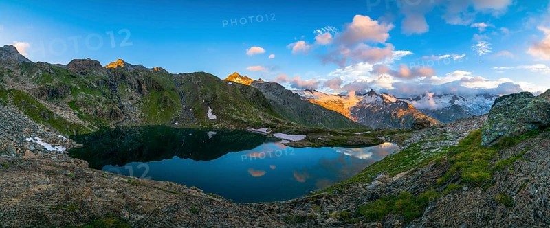 Lake Schwarzsee in the evening light with mountain range