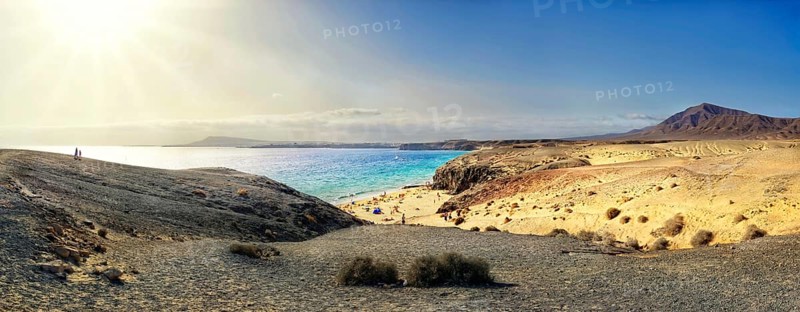 Sandy beach and rocky coastline with turquoise waters of Playa del Papagayo