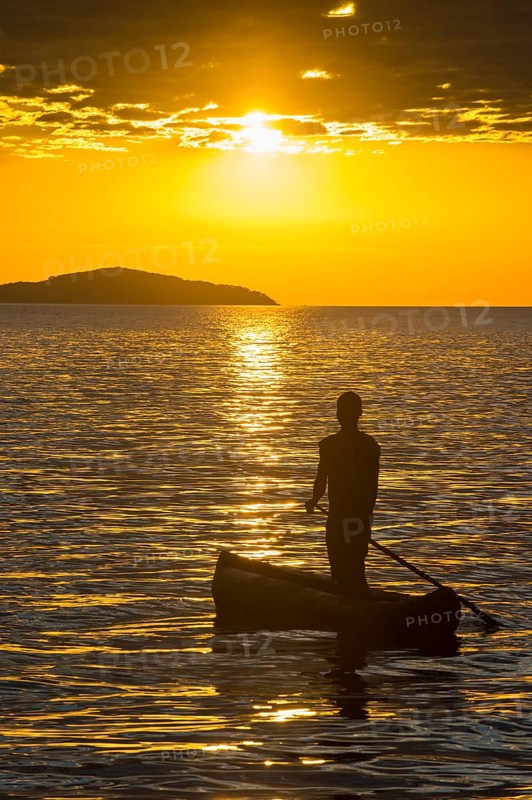 Fisherman in his canoe on Lake Malawi