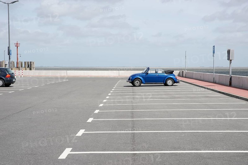 Blue Beetle cabriolet stands at the port of Wyk on Fohr