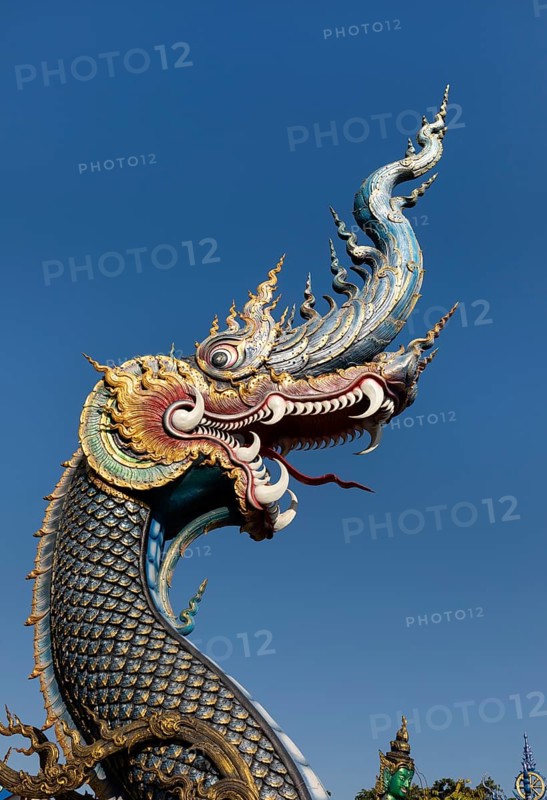 Richly decorated Naga at the entrance of Wat Rong Seur Ten