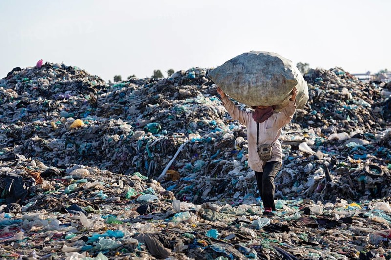Garbage collector on garbage dump