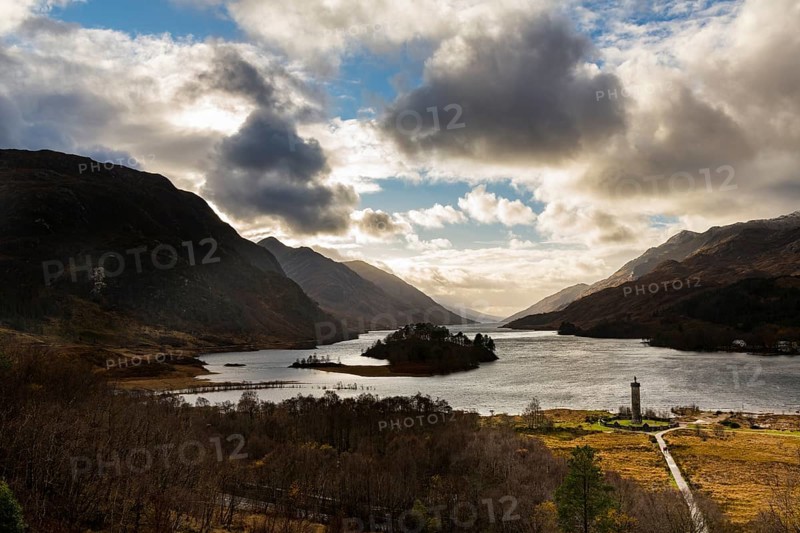 Loch Shiel with Glenfinnan Monument under cloudy sky