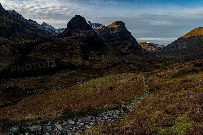 Hiking trail in mountain scenery with peaks of Stob Coire nan Lochan