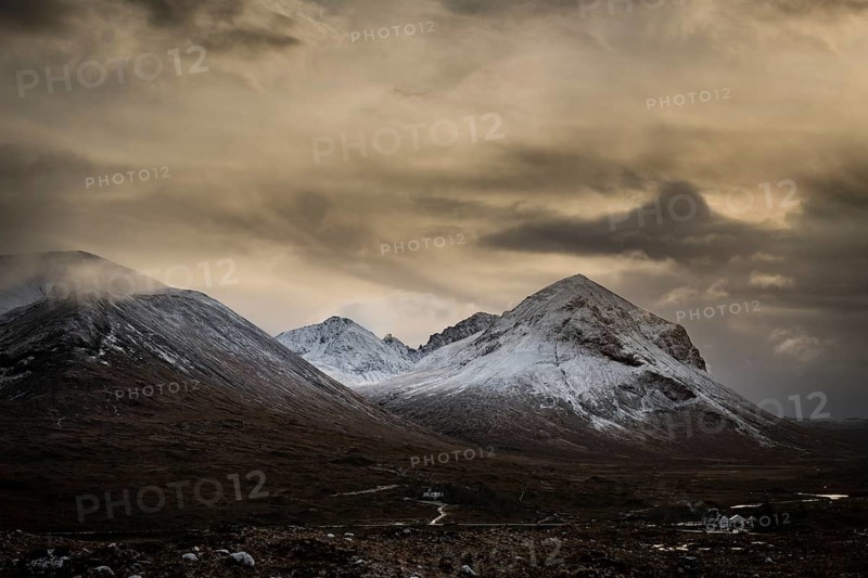Snowy mountain tops of Ben Lee with clouds in Highland landscape