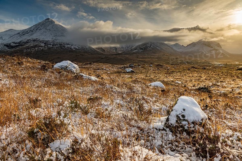 Snowy mountain tops of Ben Lee with clouds in Highland landscape
