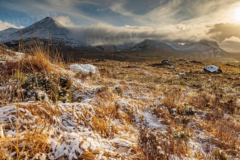 Snowy mountain tops of Ben Lee with clouds in Highland landscape