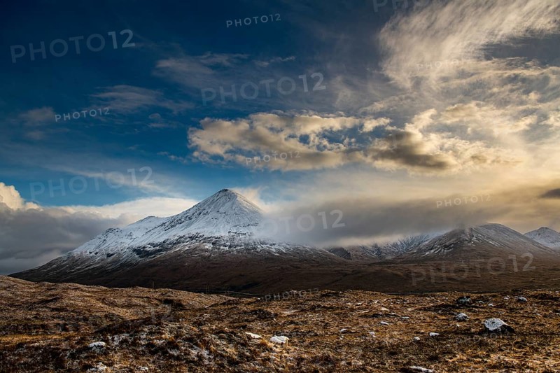 Snowy mountain tops of Ben Lee with clouds in Highland landscape