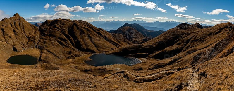Small and medium Seefeldsee lake with autumnal mountains in the background