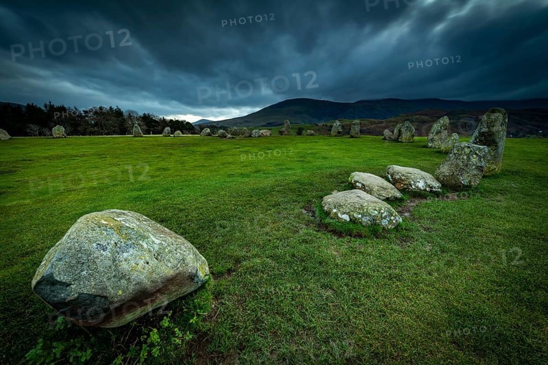 Stone circle with dramatic cloud sky