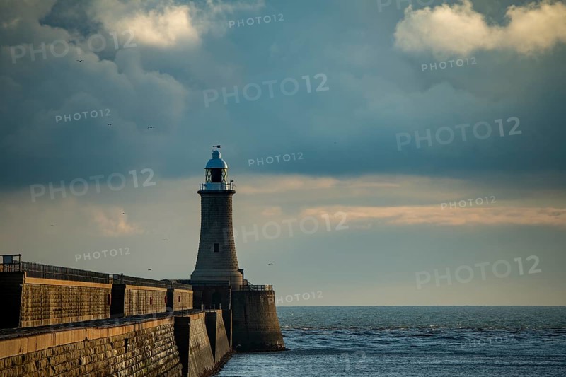 Lighthouse with harbour wall
