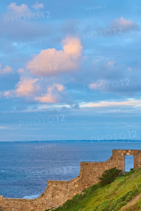 Door trough a wall to the beach of the atlantic ocean at Hondarribia