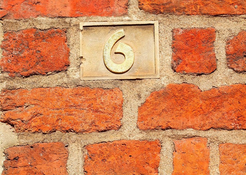Old golden house number plate