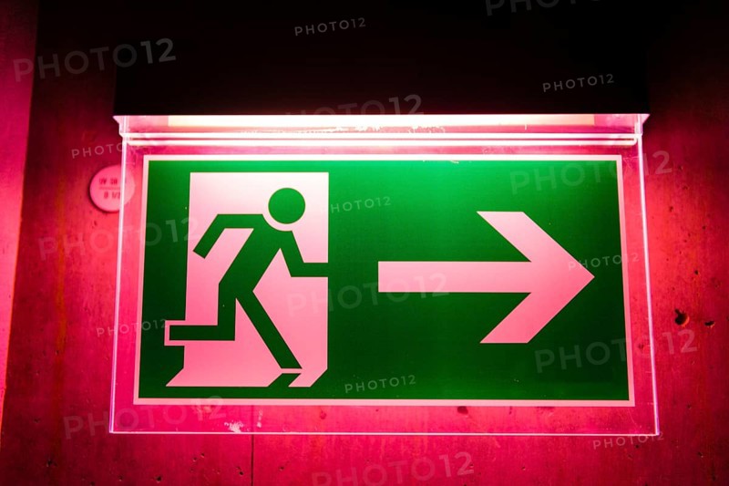 Red illuminated emergency exit sign