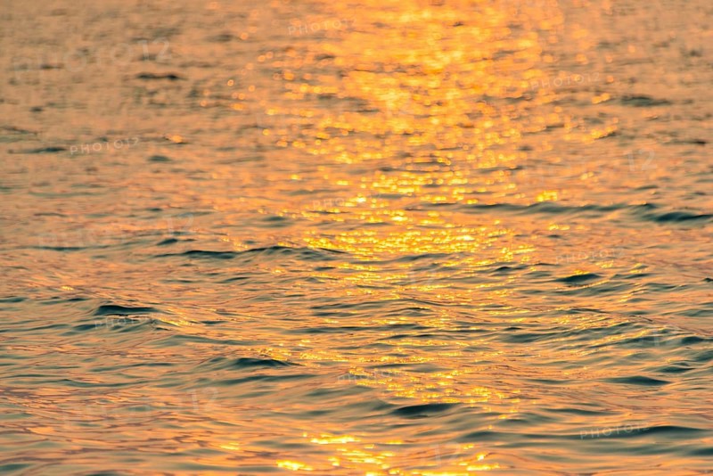 Sunlight reflecting on sea at sunrise from Koh Tui Beach