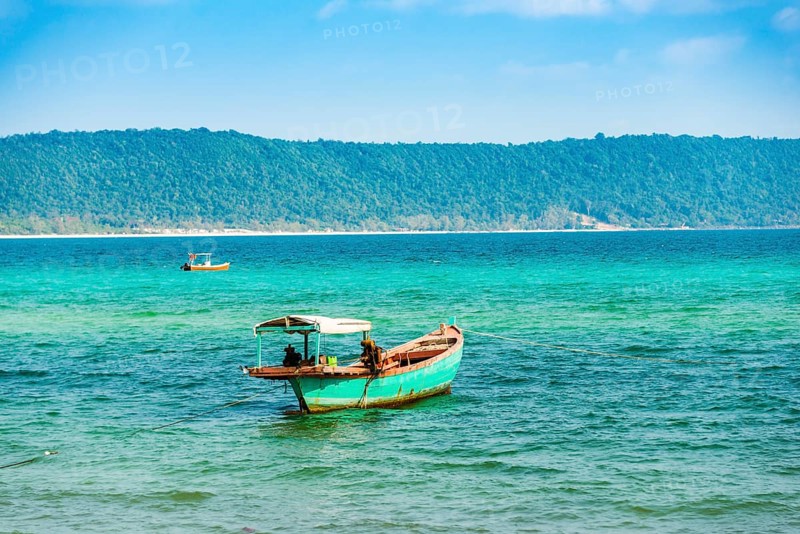 Traditional long-tail boat in turquoise sea