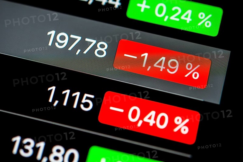 Close up of rising and falling stock prices on smartphone screen