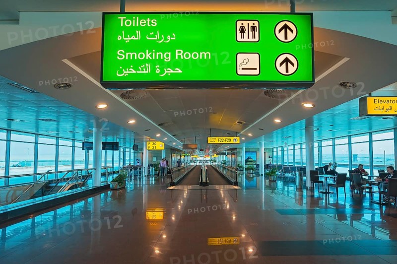 Moving walkway and signs at the airport