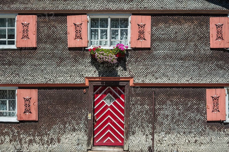 Facade with weathered wood shingles