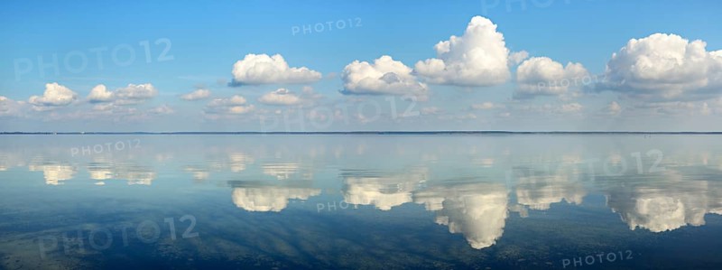 Clouds are reflected in the calm water