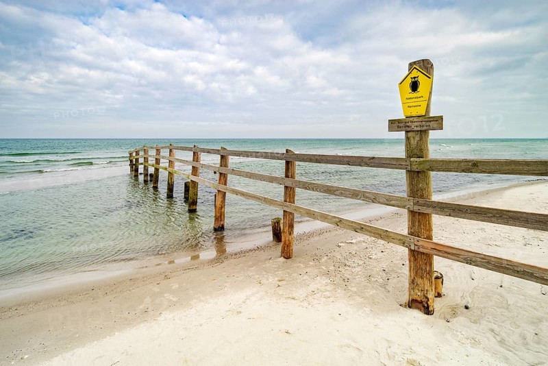 Fence on the beach of the Baltic Sea as border of the closed off core zone of the Western Pomerania Lagoon Area National Park