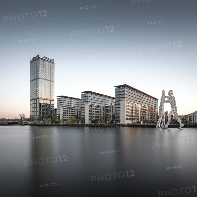 Allianz Tower on the River Spree with the Molecule Man monument by American artist Jonathan Borofsky