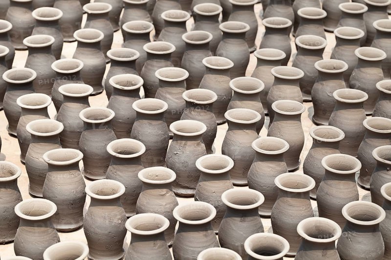 Rows of pots drying in the sun in potters square