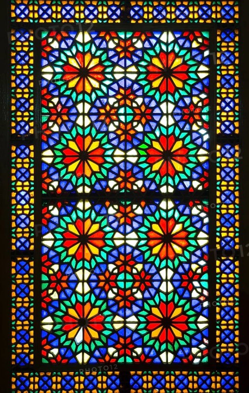 Ornamental colourful window at Bagh-e Dolat Abad