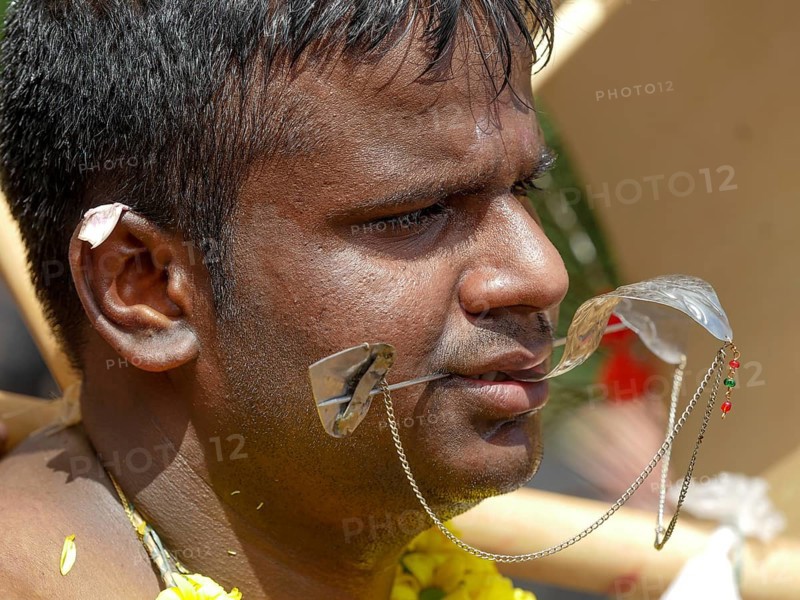 Kavadi dancers with pierced cheeks