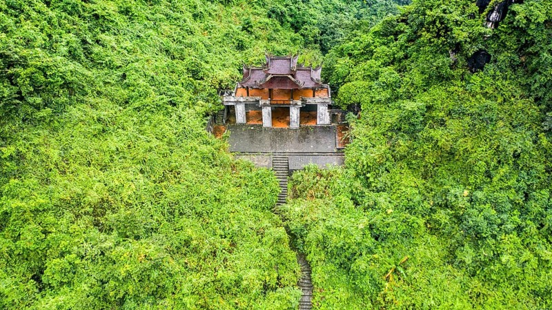 Temple ruin in green jungle above the river