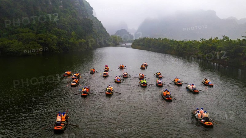 Rowing boats with tourists on river
