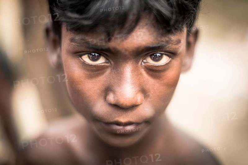 Portrait of a boy in a brickyard