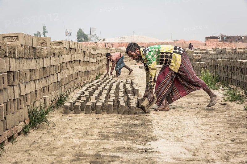 Brick factory worker Stacks dried bricks