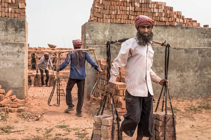 Brickworks worker transports bricks