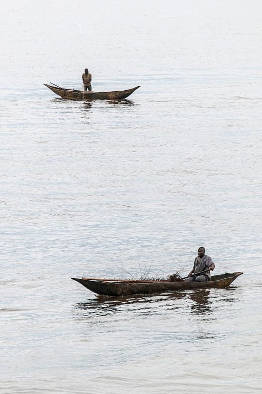 Two fishermen in a pirogue