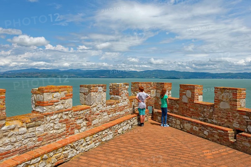 Two children stand on battlements