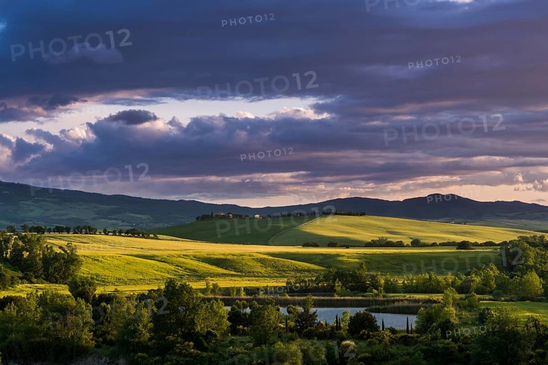 Typical green Tuscan landscape in Val d'Orcia with hills