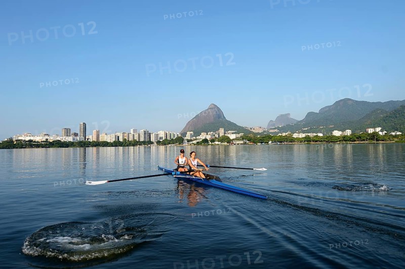 Two young women participating in early morning rowing training in the Lagoa Rodrigo de Freitas Lagoon