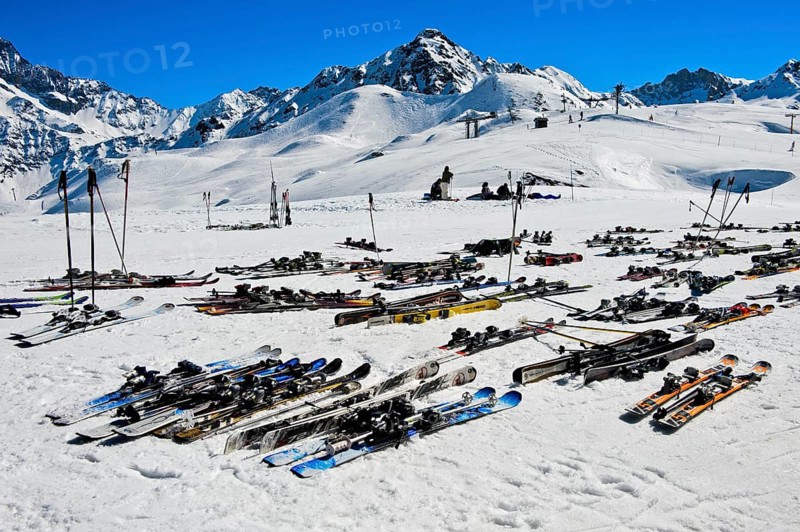 Pairs of skis lying on snow, Les Contamines-Montjoie ski resort