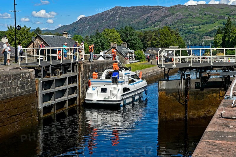Motorboat passing through lock in Caledonian Canal