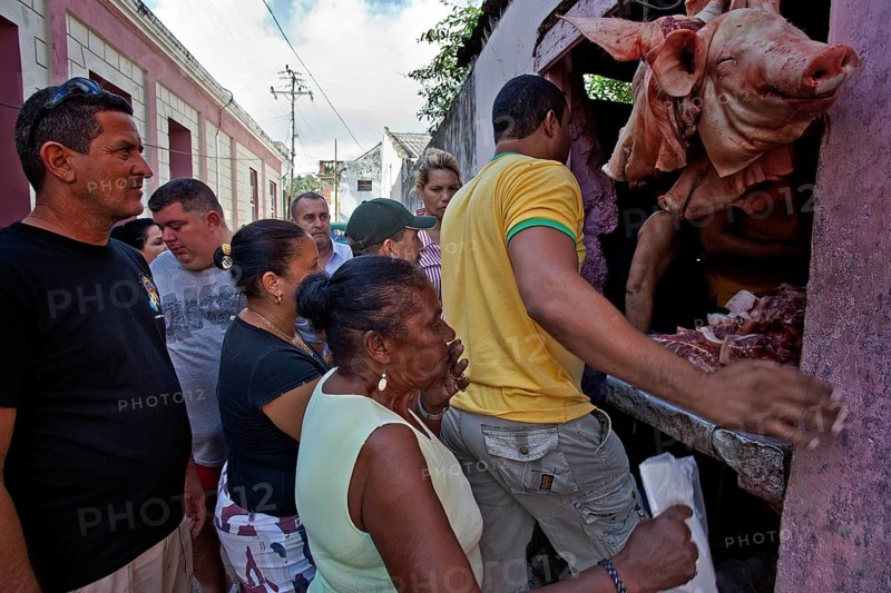 Locals at a sales stand with meat