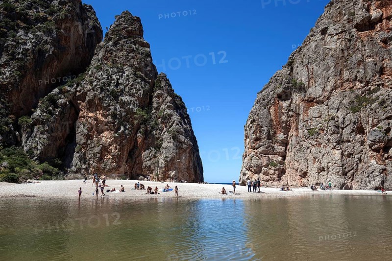 People on the beach in the gorge Torrent de Pareis