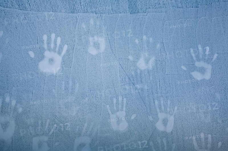 Handprints on ice wall