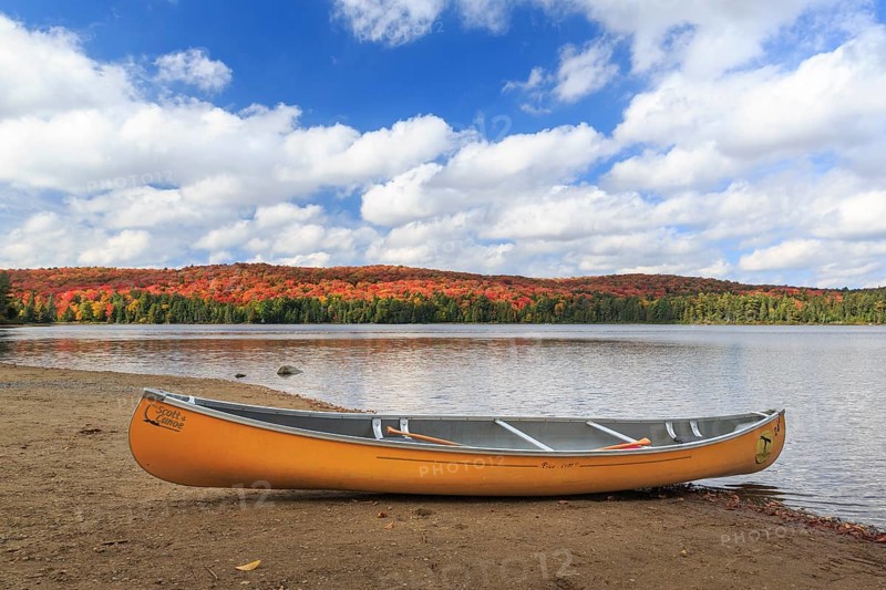 Canoeing on the shores of Canisbay Lake in Autumn