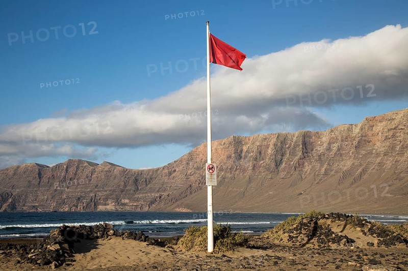 Red flag flying warning of bathing danger