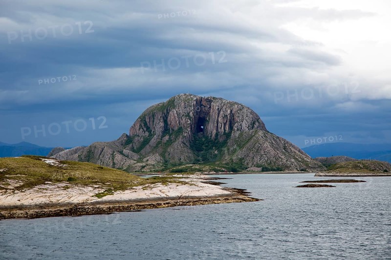 Torghatten granite mountain with a hole through it