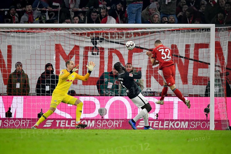Header Joshua Kimmich FC Bayern Munich against goalkeeper Peter Gulacsi RasenBallsport Leipzig RBL